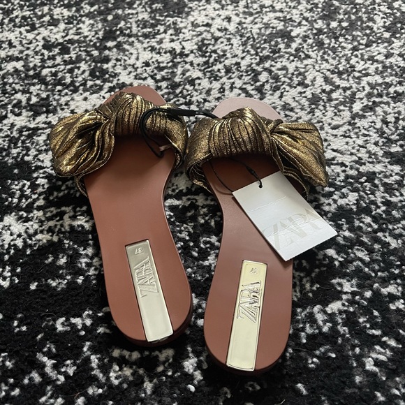 Gold sandals. Never worn.